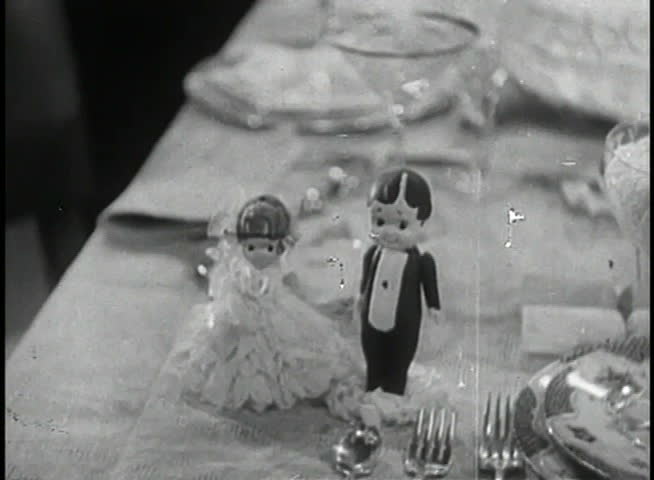 Bride and groom dolls on dining table
