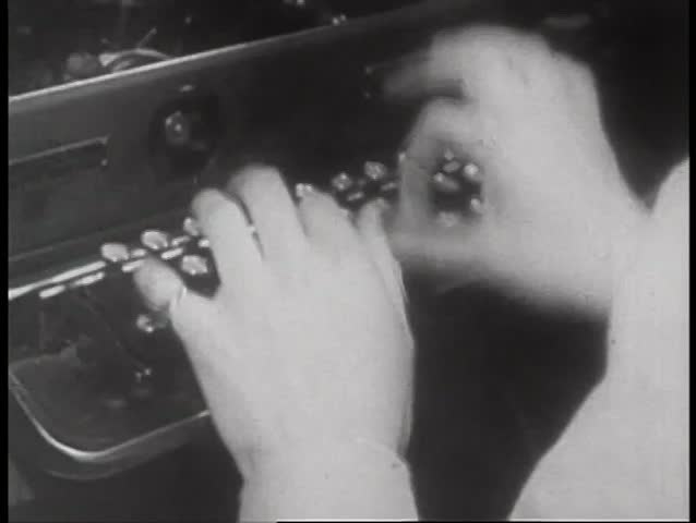 Close-up of woman typing on typewriter