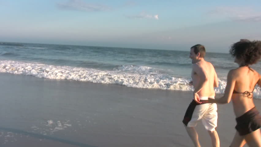 Playful couple at the beach