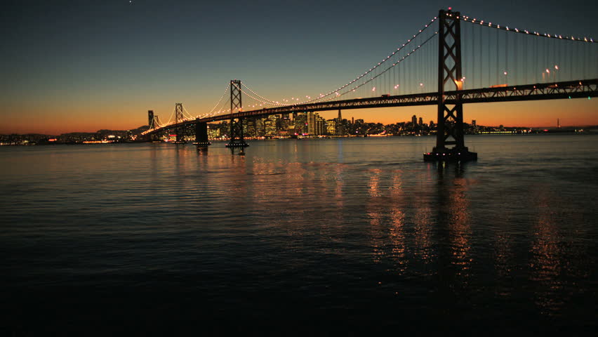 Aerial sunset low level majestic view of the iconic Oakland Bay bridge, San Francisco bay, North America