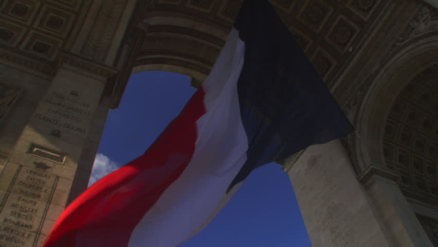 Time lapse, Low angle view of flag under Arc de Triomphe, Paris, France