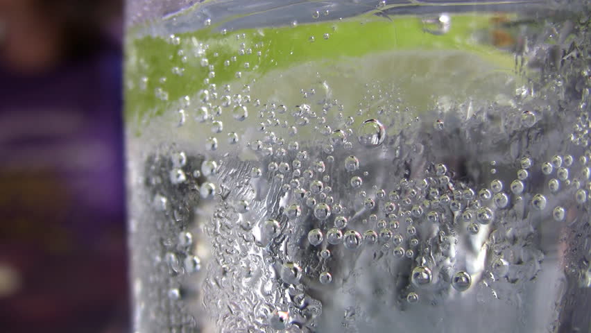 Closeup of a cold and refreshing glass of sparkling water...with a slice of lime. 