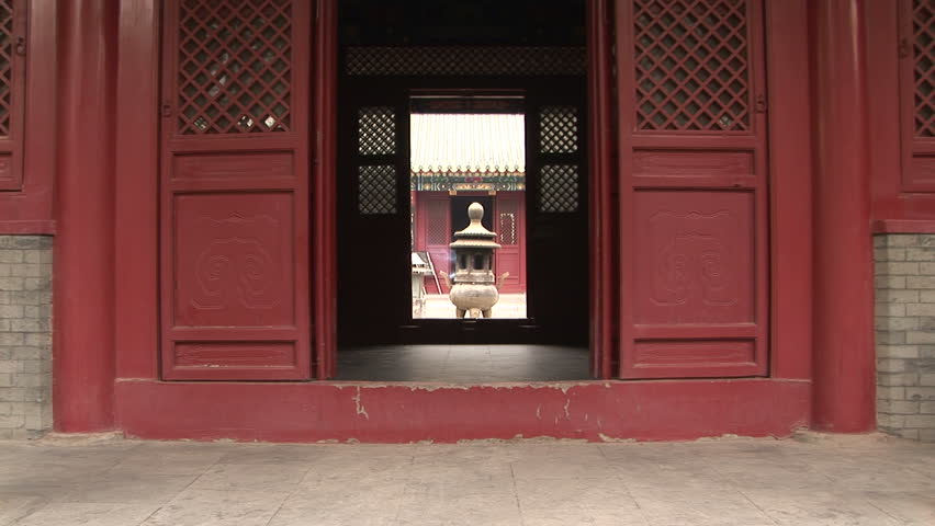 Bronze pagoda incense burner through door, White Cloud Temple, world's oldest Taoist temple, Beijing, China, zoom in.