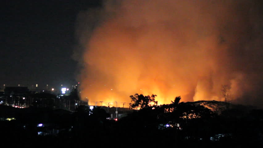 Wild fires burn out of control in a grassy field on the outskirts of Bangkok, Thailand.