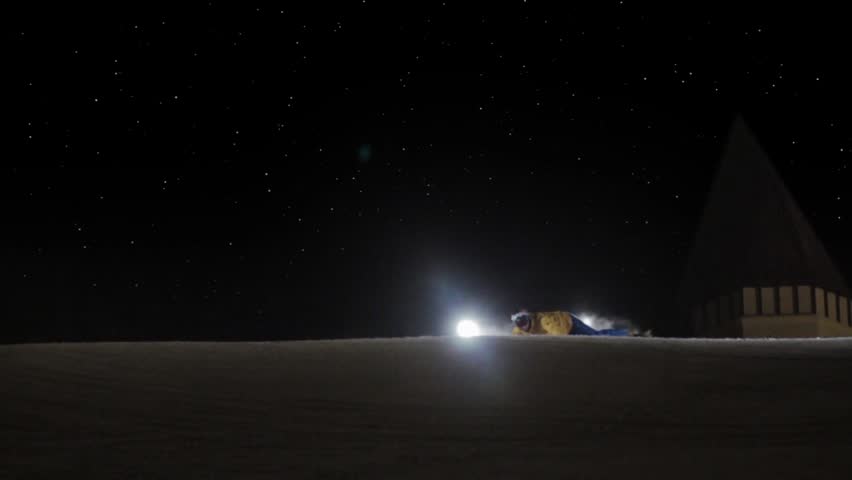 HD super slow motion. Snowboarding in night.