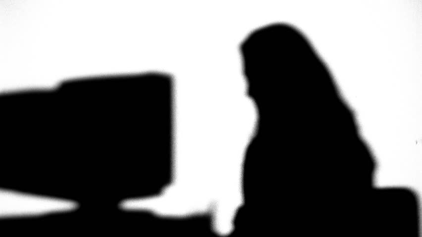 Silhouette of co-workers talking