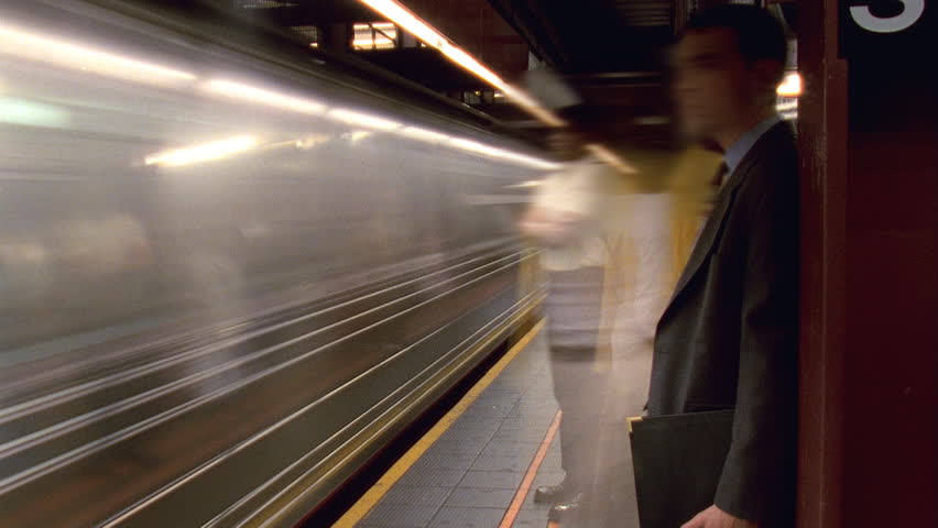 NEW YORK - CIRCA 2003: Timelapse of people waiting for trains in the 14th Street subway station in New York City circa 2003