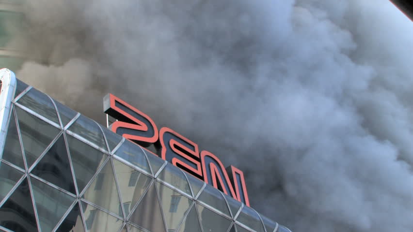 BANGKOK, THAILAND - APRIL 19: Zen Central Department Store engulfed in smoke and flames during "Red Shirt" violent protest riots on April 19, 2010 in Bangkok, Thailand