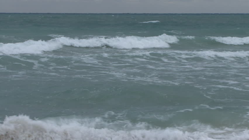  Male walking into the ocean
