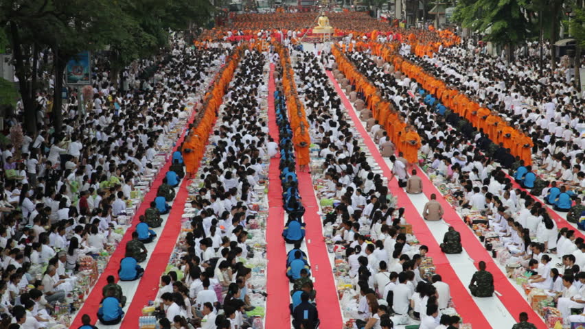 BANGKOK, MARCH 18, 2012: Monks are participating in a Mass Alms Giving of 12,600 monks for the Makha Bucha celebrations in Bangkok, Thailand  on March 18, 2012. 