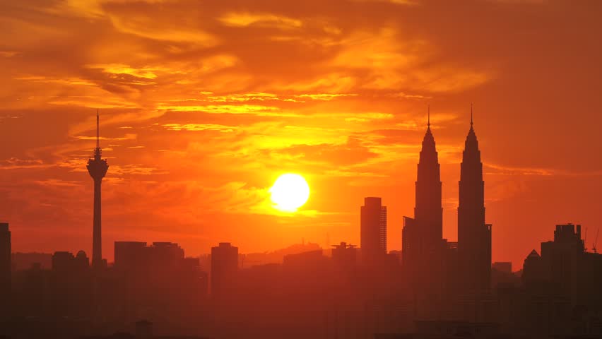 Sunset time lapse with PETRONAS Twin Tower and Kuala Lumpur Tower in the background.
