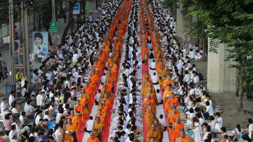 BANGKOK - MARCH 17: Monks are participating in a Mass Alms Giving of 12,600 monks for the Makha Bucha celebrations on March 17, 2012 in Bangkok, Thailand.