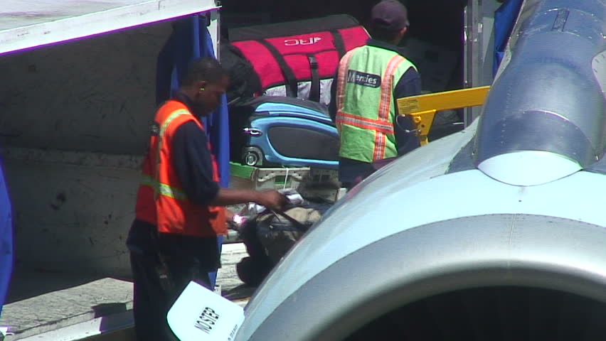 Luggage being unloaded.