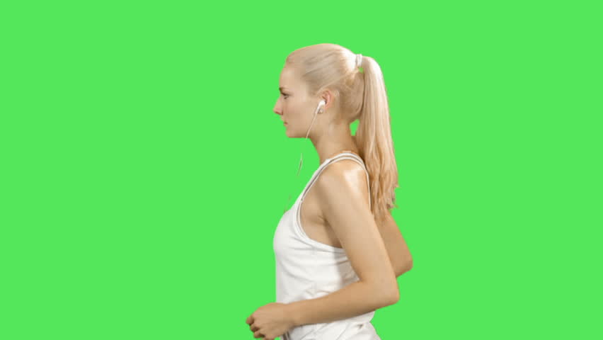 Female jogging on greenscreen 