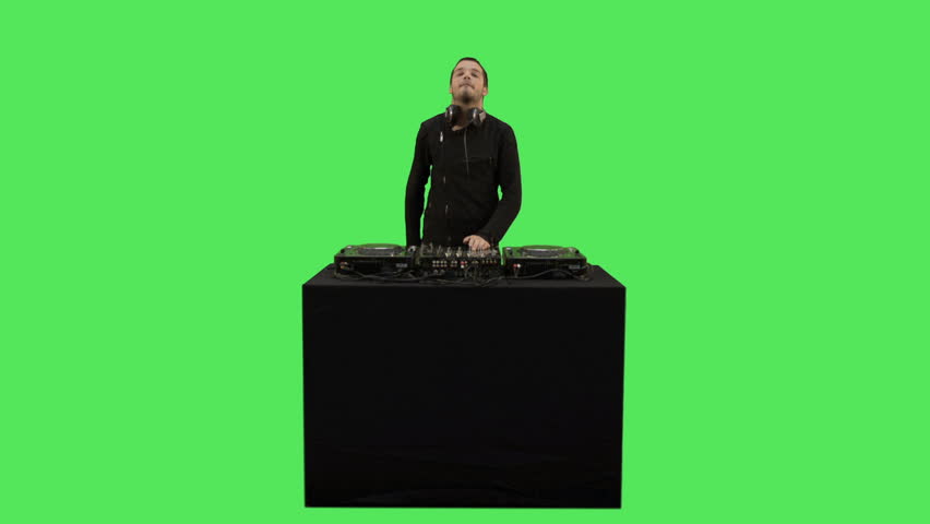 Male DJ playing music on turntable decks 