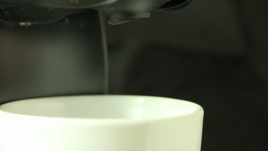 Expresso coffee machine serving milk
