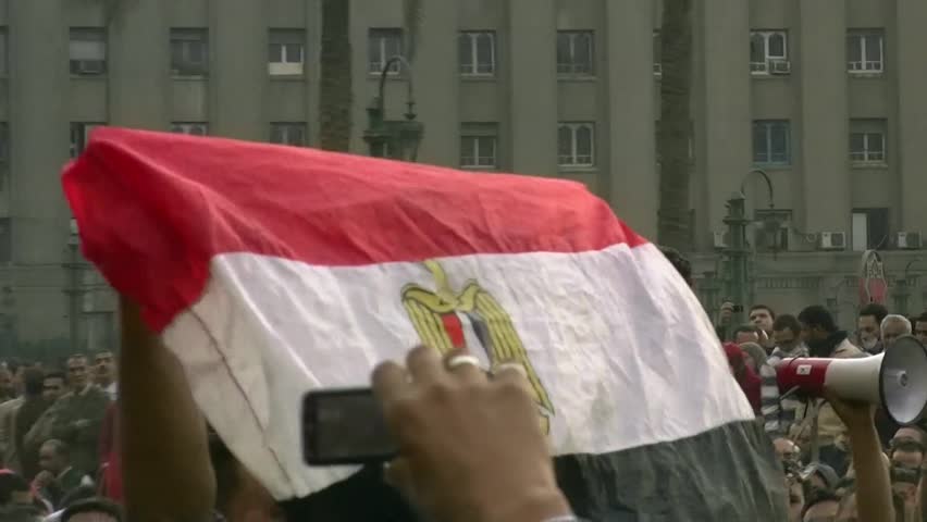 CAIRO - NOV 19: An Egyptian flag in the crowd in Tahrir Square on November 19, 2011 in Cairo, Egypt.