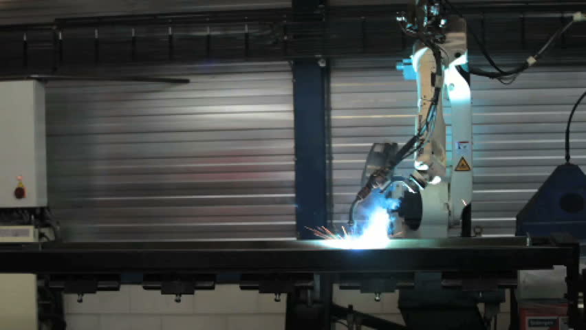welding robot welds metal plates with a robotic arm