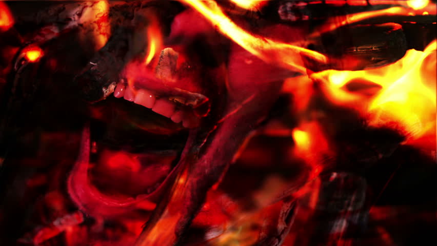 Demon face screaming in hell fire flames. Religious concept.