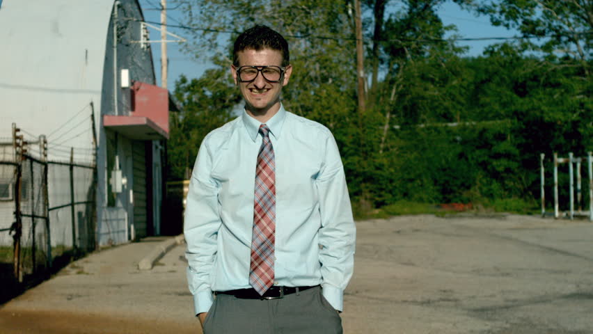 Businessman getting hit in face by water balloon - slow motion