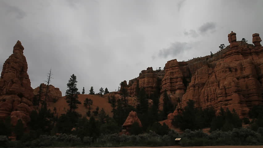 View of unusual rock formations with large rocks balanced on top