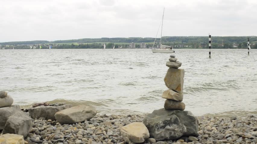 feng shui stone figure with sailing ship at lake Bodensee germany