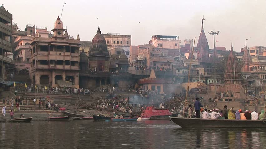 Veranasi, India - Circa November 2008: Burning ghat with funeral pyres and fires are burning on banks of Ganges.