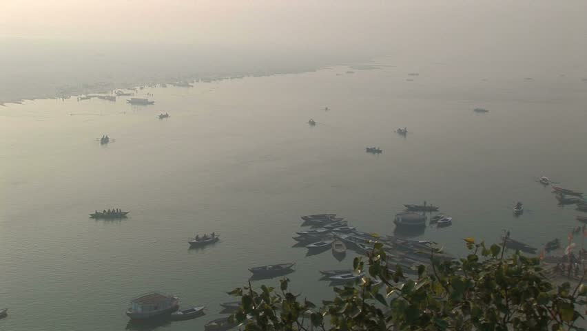 Ganges river and pilgrim boats in early morning hazy light, Veranasi, India