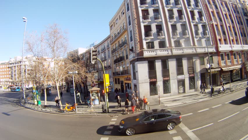 MADRID - MAR 11: (Timelapse View) Bus go on city streets along show-windows of shops, on Mar 11, 2012 in Madrid, Spain
