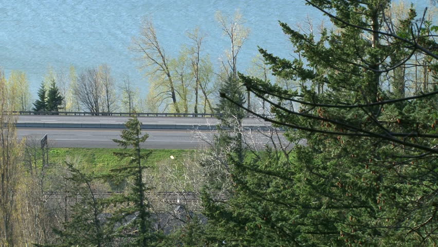 Time Lapse from high vantage point atop Angel's Rest in the Oregon Gorge shows the Columbia River in Oregon and Interstate 84 with traffic.