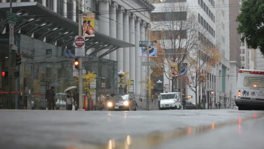 Downtown San Francisco on a rainy day in 2009. Pedestrians walking in a crosswalk on a rainy day in San Francisco, California.