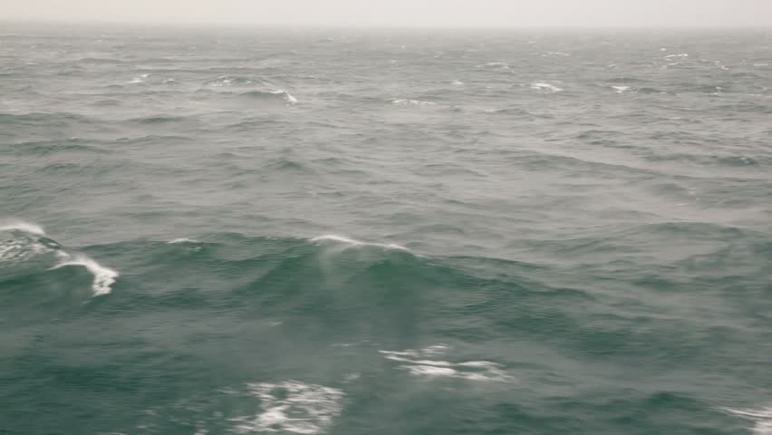 Pure blue sky on horizon of seascape with wavy water surface