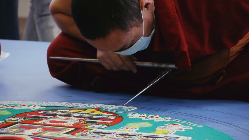 NOVOSIBIRSK - CIRCA APRIL 2012: Tibetan monks making sand mandala circa April 2012 in Novosibirsk, Russia.
