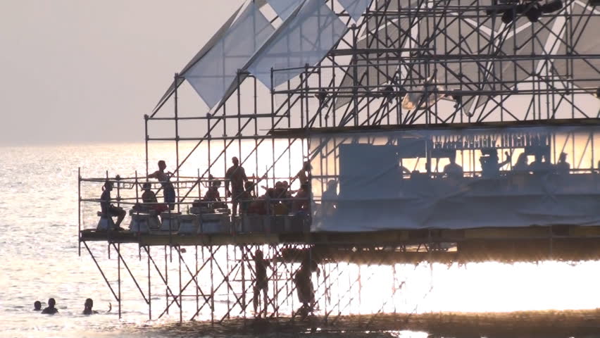 close-up of a dancefloor over the sea, during sunset at music festival in ukraine