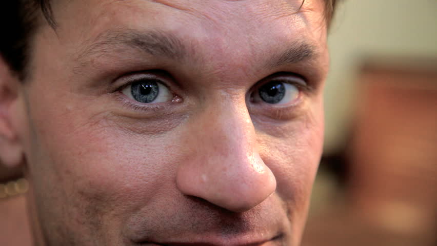 close up of young adult man smiling
