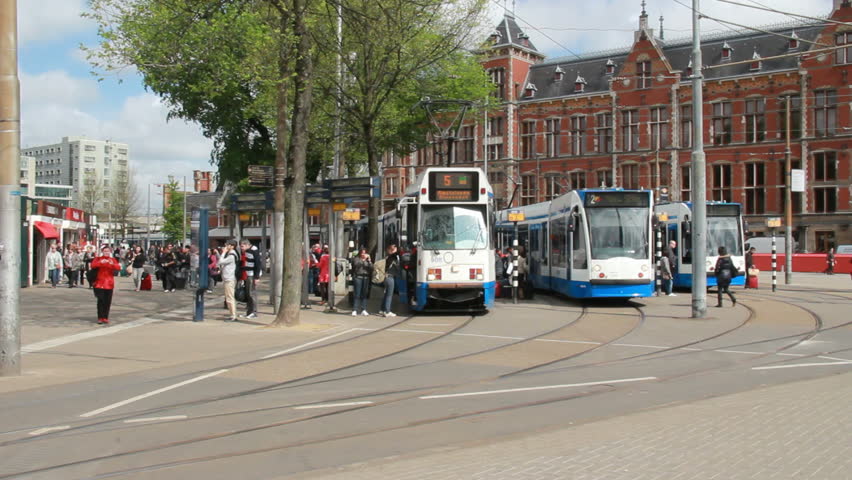 AMSTERDAM, HOLLAND - MAY 25: Tram departs from the Central Railway Station on May 25, 2012 in Amsterdam, Holland. Trams are the most popular means of public transportation in Amsterdam
