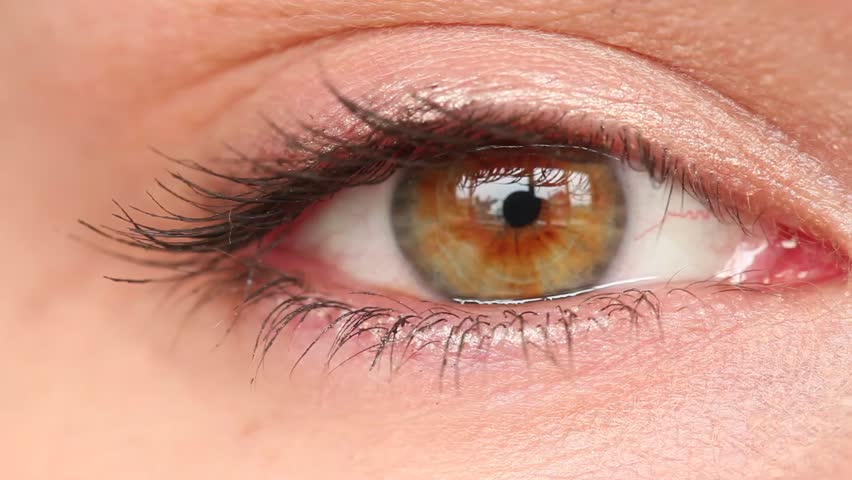 women's eye close up looking around no correction