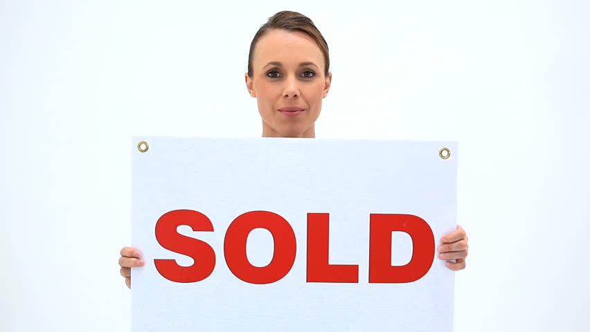 Happy woman holding a placard against a white background