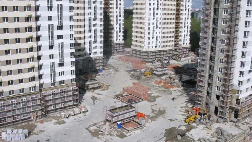 Trucks bring construction materials on building site. timelapse, 