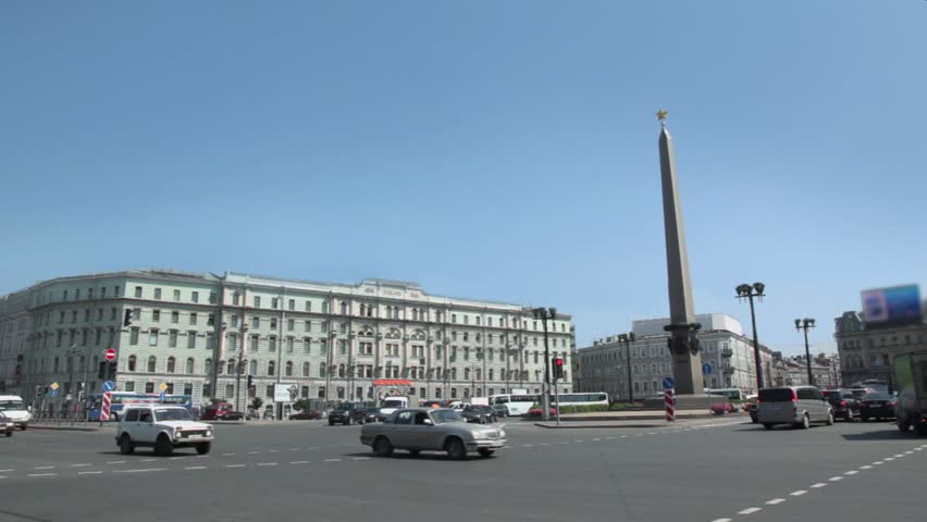 City traffic on Square Uprising with obelisk in center at Petersburg city
