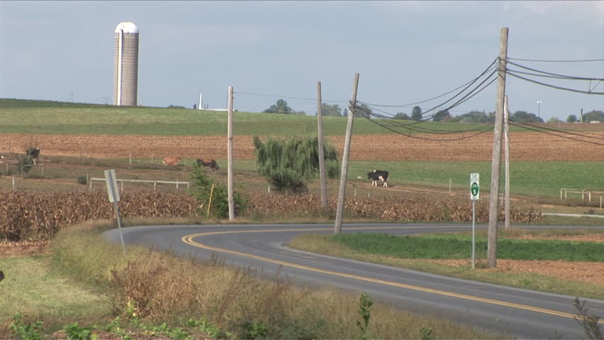 Amish horse and buggy next to farm in Lancaster, Pennsylvania