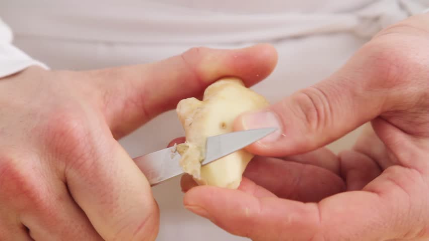 Peeling ginger root