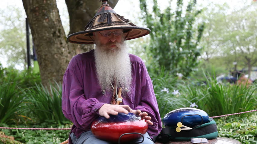 Drum player at FolkLife Festival in Seattle center, Washington State, USA.
(Drum made out of propane tank)