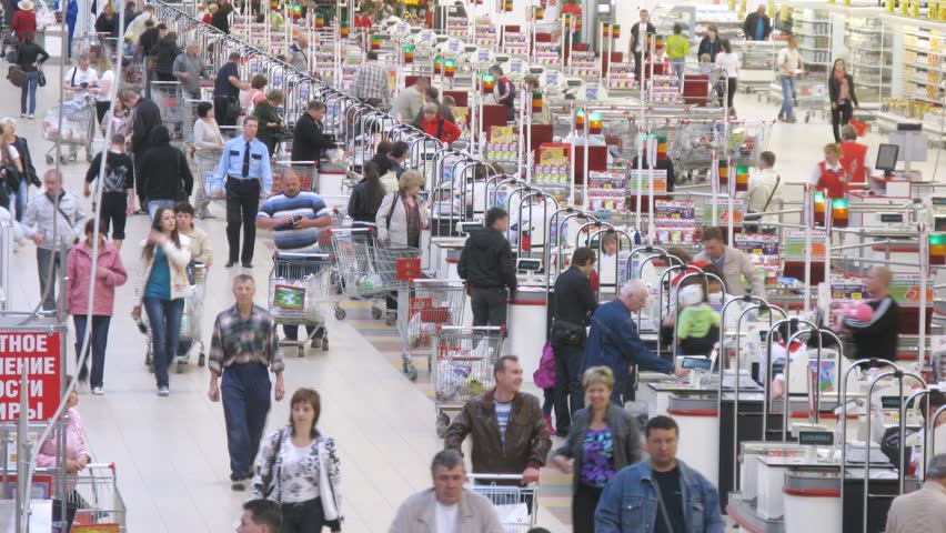 SAMARA - MAY 5: (Timelapse View) People carry carts with products to cash desk in Auchan superstore, on May 5, 2012 in Samara, Russia. In Russia there are currenly 50 Auchan superstores.