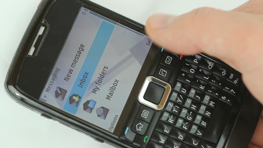 Male hand typing on smartphone: "I am still at work, please call back later"