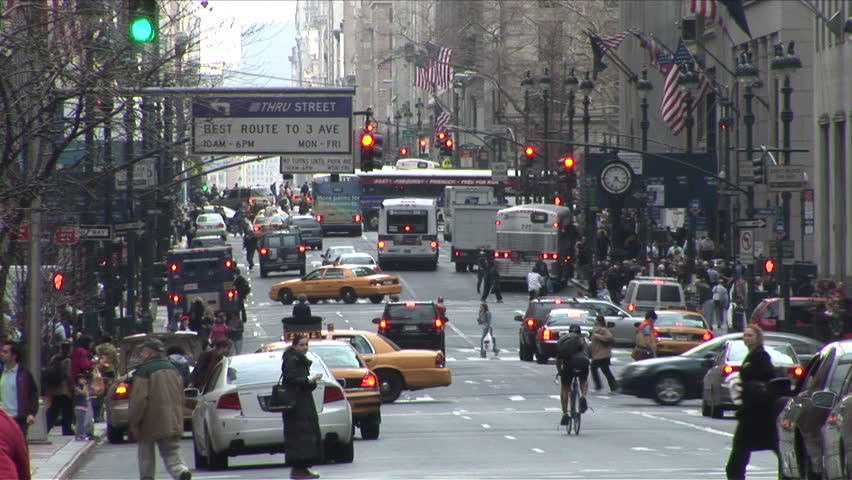 New York, NY - CIRCA March 2006: The busy streets of Manhattan are constantly full of cabs, bikes, buses and other vehicles yet they operate in harmony with many pedestrians