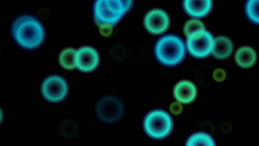 Circles of light flash on the screen as if dancing to the beat of a song. (High Definition 1080p)