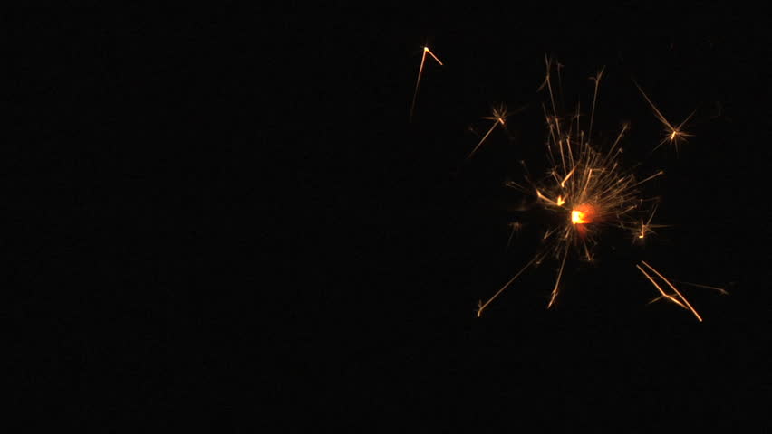 yellow sparkler on black