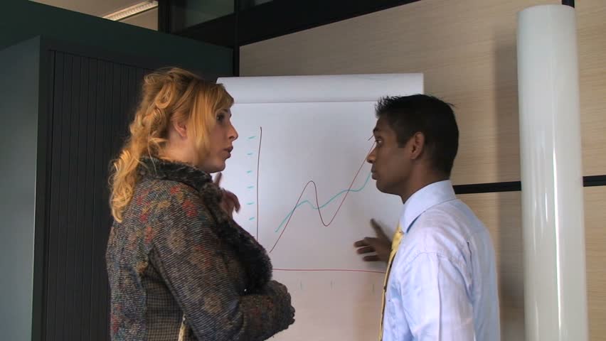 Business Partners Discussing Sales with Graph Chart