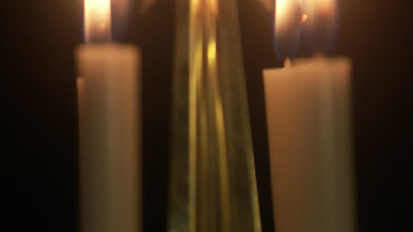 A Christmas decoration with burning candles.